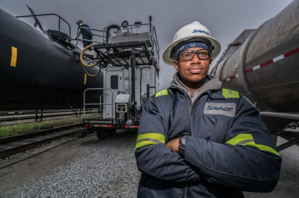 Gusramher Team Member in front of locomotive transloading